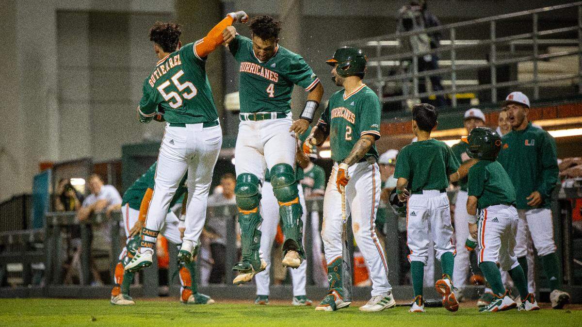 UM’s Gaby Gutierrez celebrates with catcher Maxwell Romero after Gutierrez’s first career home run in the fifth inning against Virginia on April 8, 2022. Photo by Kylie Greenwell/Miami Athletics