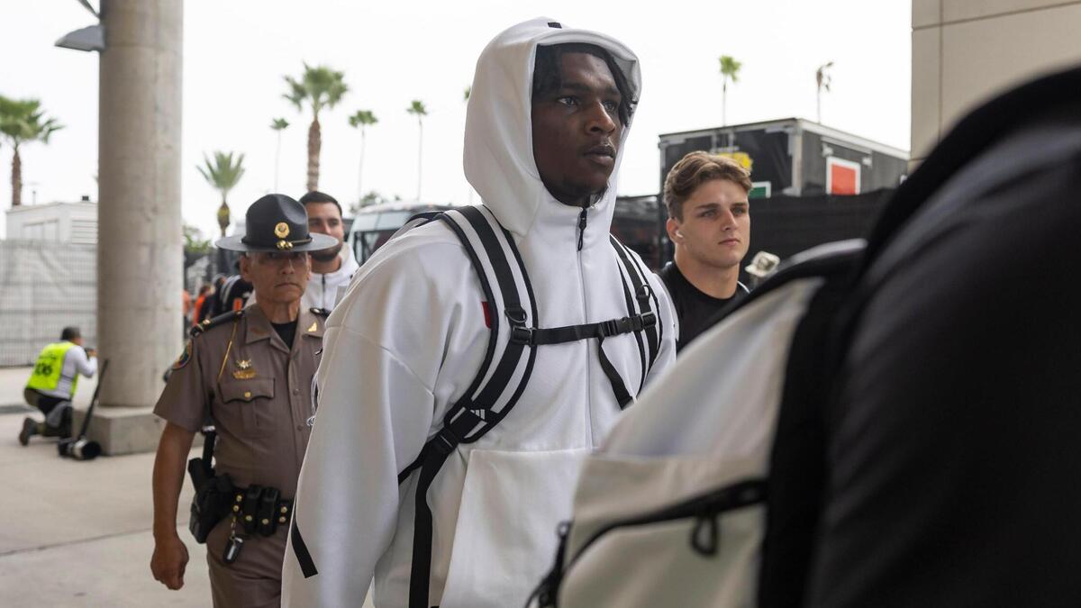 Miami Hurricanes quarterback Cam Ward (1) arrives to the Camping World Stadium before the start of his Pop-Tarts Bowl football game against the Iowa State Cyclones on Saturday, Dec. 28, 2024, in Orlando, Fla.