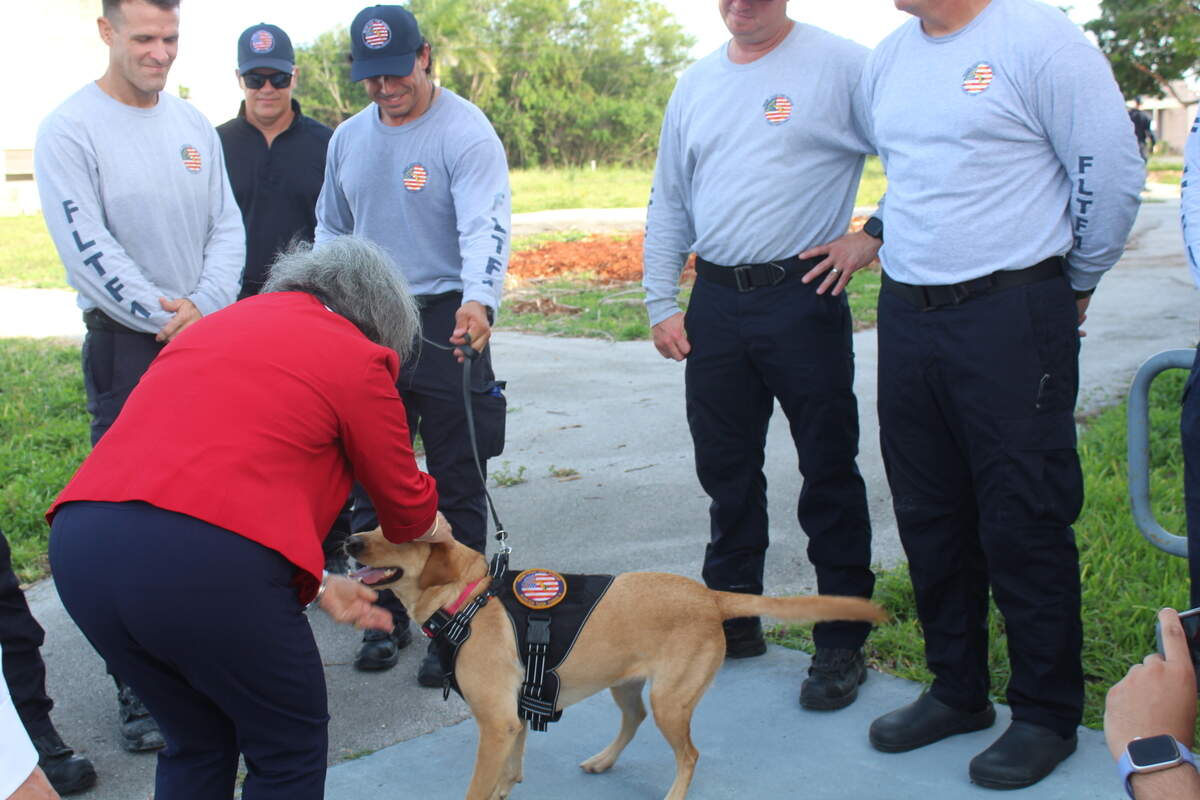 Miami-Dade Mayor Daniella Levine Cava greets rescue K-9 Whelan, who prepares to deploy to Venezuela with over 80 firefighters to aid in rescue missions after two devastating earthquakes.