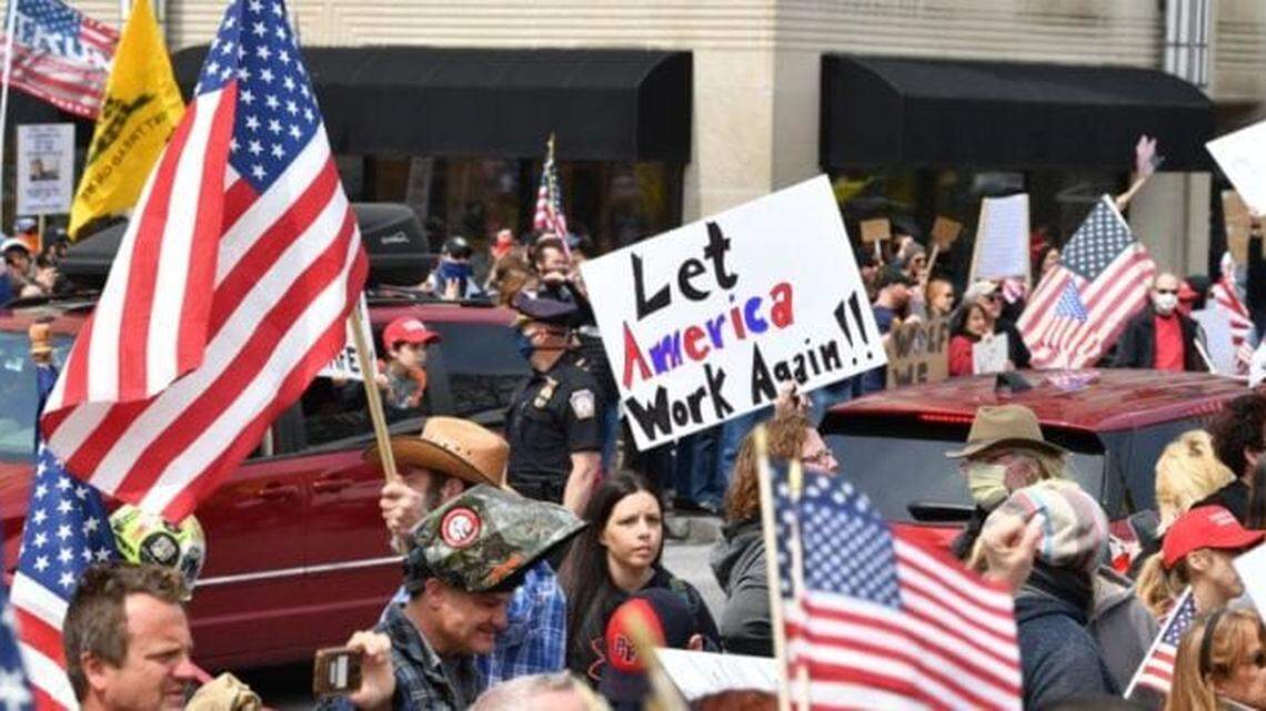 Protesters march through downtown Raleigh, North Carolina, demanding that the coronavirus lockdown end.