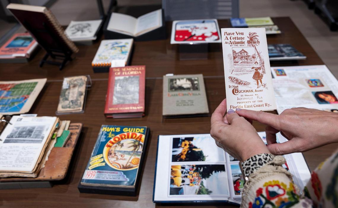Cristina Favretto, head of the special collections library at the University of Miami, points to an old promotional pamphlet that’s part of a vast collection at the archive of brochures, cookbooks, restaurant menus and other ephemera from Miami and the rest of Florida going back decades.