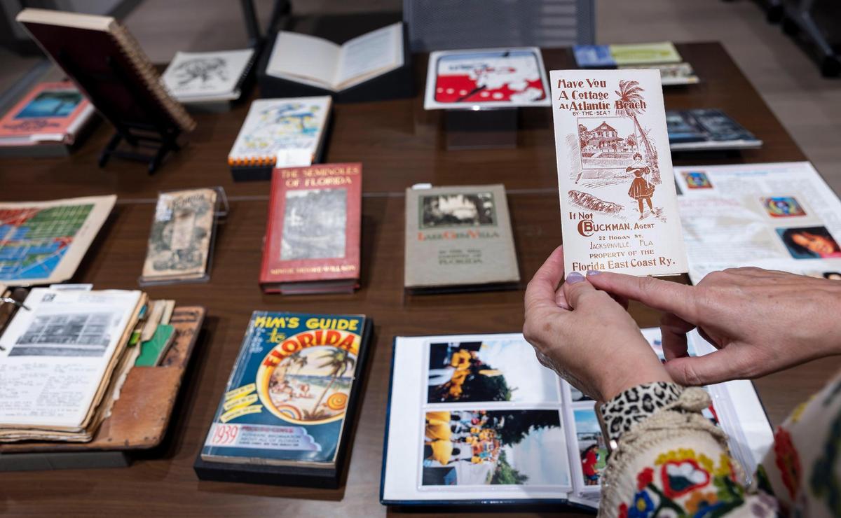 Cristina Favretto, head of the special collections library at the University of Miami, points to an old promotional pamphlet that’s part of a vast collection at the archive of brochures, cookbooks, restaurant menus and other ephemera from Miami and the rest of Florida going back decades.