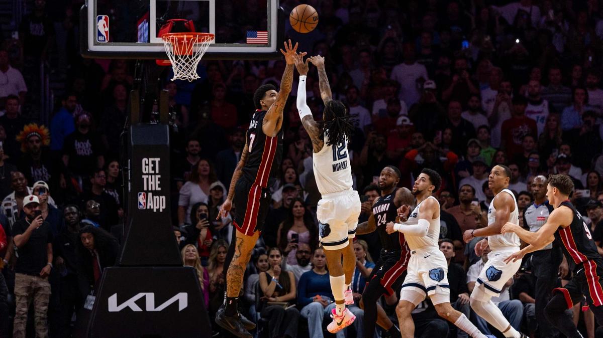 Memphis Grizzlies guard Ja Morant (12) shoots a game-winning buzzer beater over Miami Heat center Kel’el Ware (7) during the second half of an NBA game at Kaseya Center on April 3, 2025, in Miami.