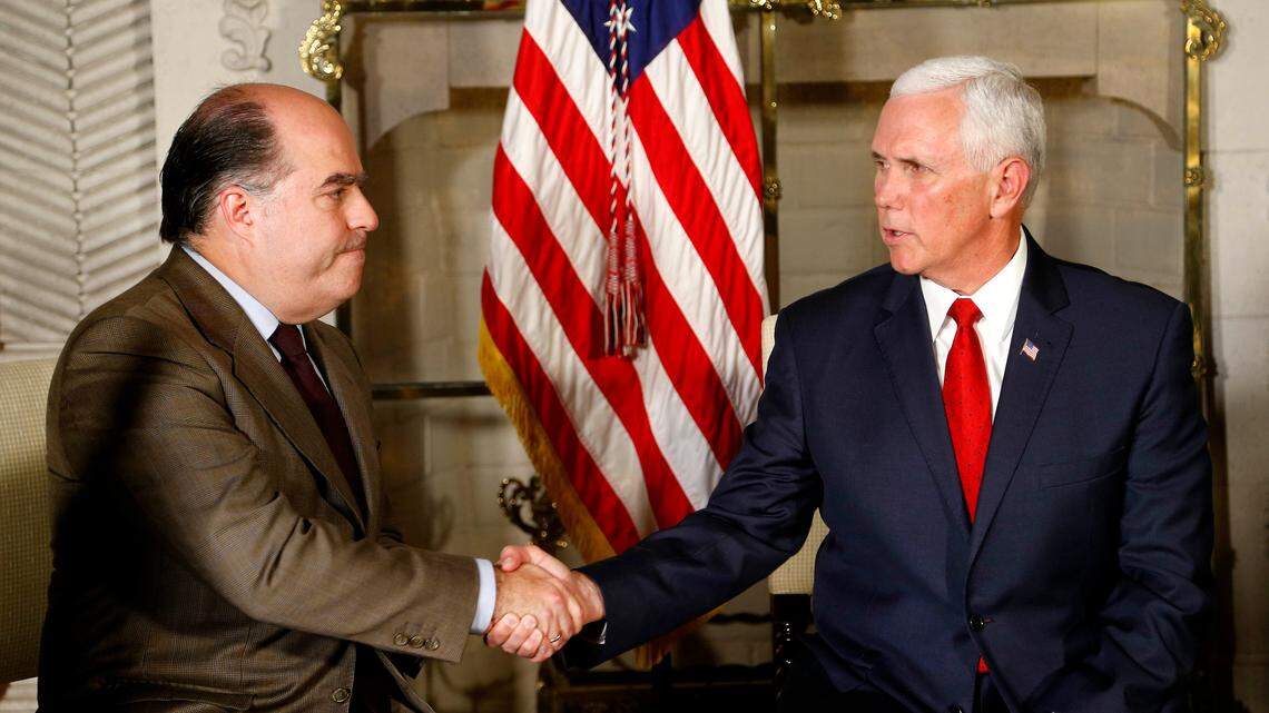 U.S. Vice President Mike Pence, right, shakes hands with Venezuelan opposition leader Julio Borges during a meeting at the residence of the U.S. ambassador, in Lima, Peru, on Friday, April 13, 2018.
