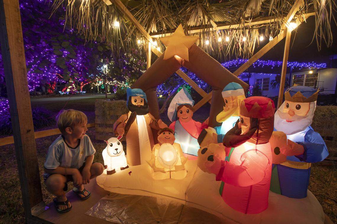 Residents of Enchanted Place in North Miami, 1600 NE 137th Terrace, decorate their cul de sac with thousands of lights and figurines, including this manger scene. They accept donations to benefit CARE Resources.