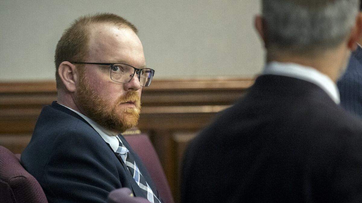 Travis McMichael listens to one of his attorneys before the trial in which he, his father Greg McMichael and a neighbor, William “Roddie” Bryan ultimately were found guilty in Ahmaud Arbery’s death, in Brunswick, Ga.