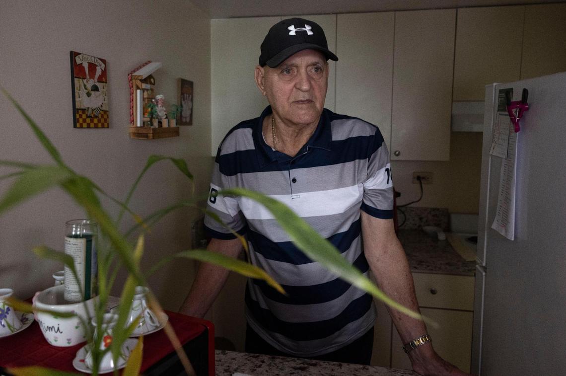Rigoberto Zarza stands in his neighbor’s kitchen on Tuesday, May 13, 2025, in Cutler Bay, Florida. Zarza voted for Trump, but he opposes cuts to SNAP, which he says “could be bad” for him and his community of retirees.