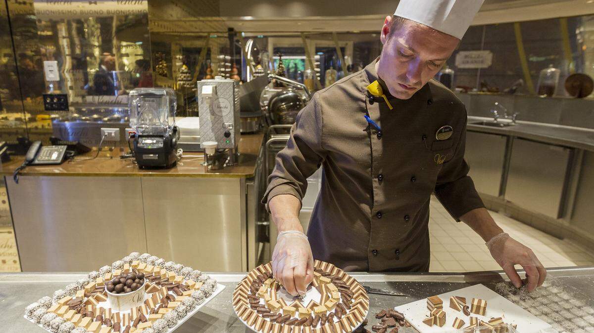 Alessio Piantanida, an executive pastry chef, preps a dessert tray with chocolate on board MSC Cruises’ newest ship, Seaside, as it was docked at PortMiami in 2017. The line has announced it plans to introduce four new luxury ships that each will carry 1,000 passengers.