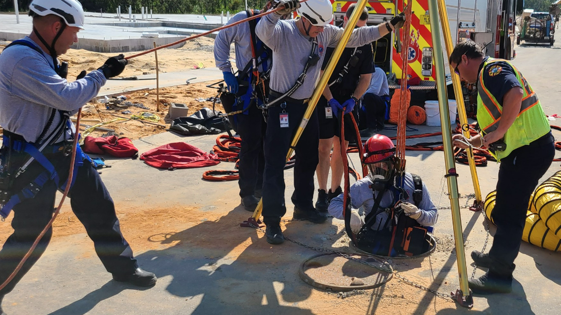 A worker tumbled 20 feet down a manhole at a construction site on the Florida Panhandle and had to be rescued, Walton County officials say.