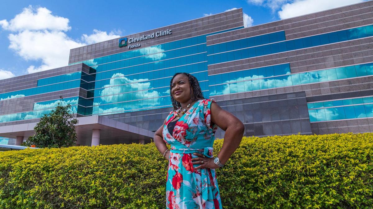 Nicole Smith, a Cardiovascular patient posed outside of the Cleveland Clinic, where she was treated back in 2023, in Weston, on Monday April 29, 2024.