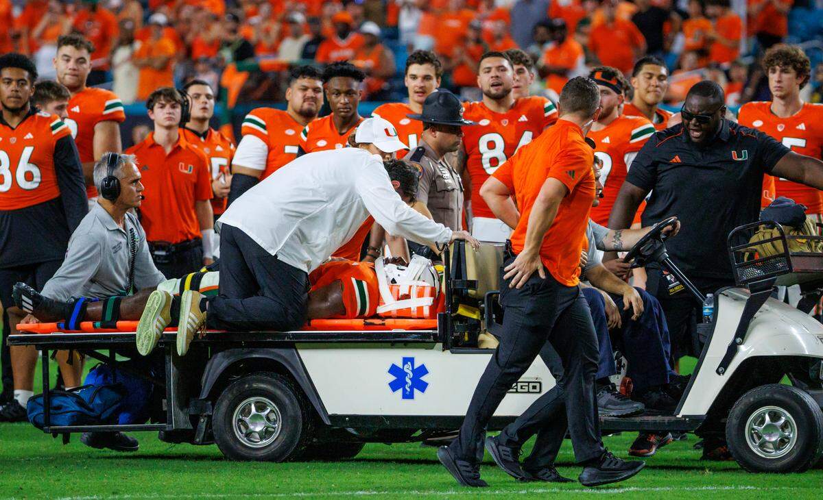 Miami Hurricanes safety Kamren Kinchens is taken off the field on a cart after an injury in a play against Texas A&M during the fourth quarter of an NCAA non conference game at Hard Rock Stadium on Saturday, Sept. 9, 2023 in Miami Gardens, Florida.