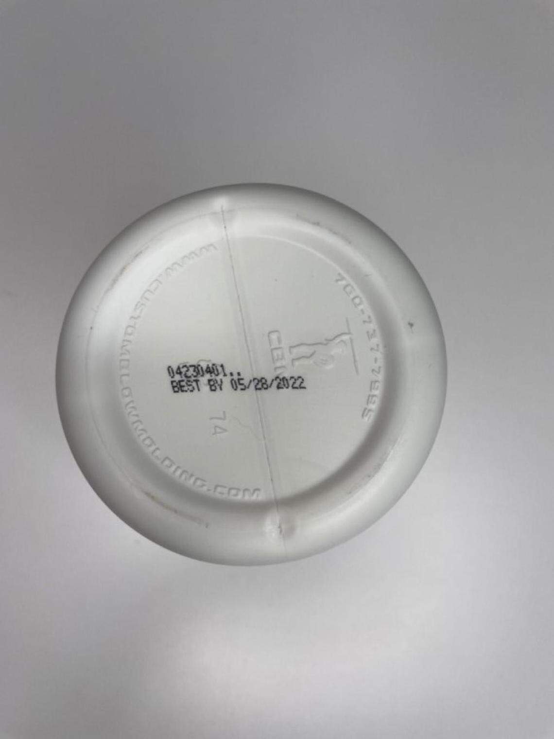 The BUBS Naturals lot code and expiration date are located on the bottom of the container, in the bottom center of the panel.