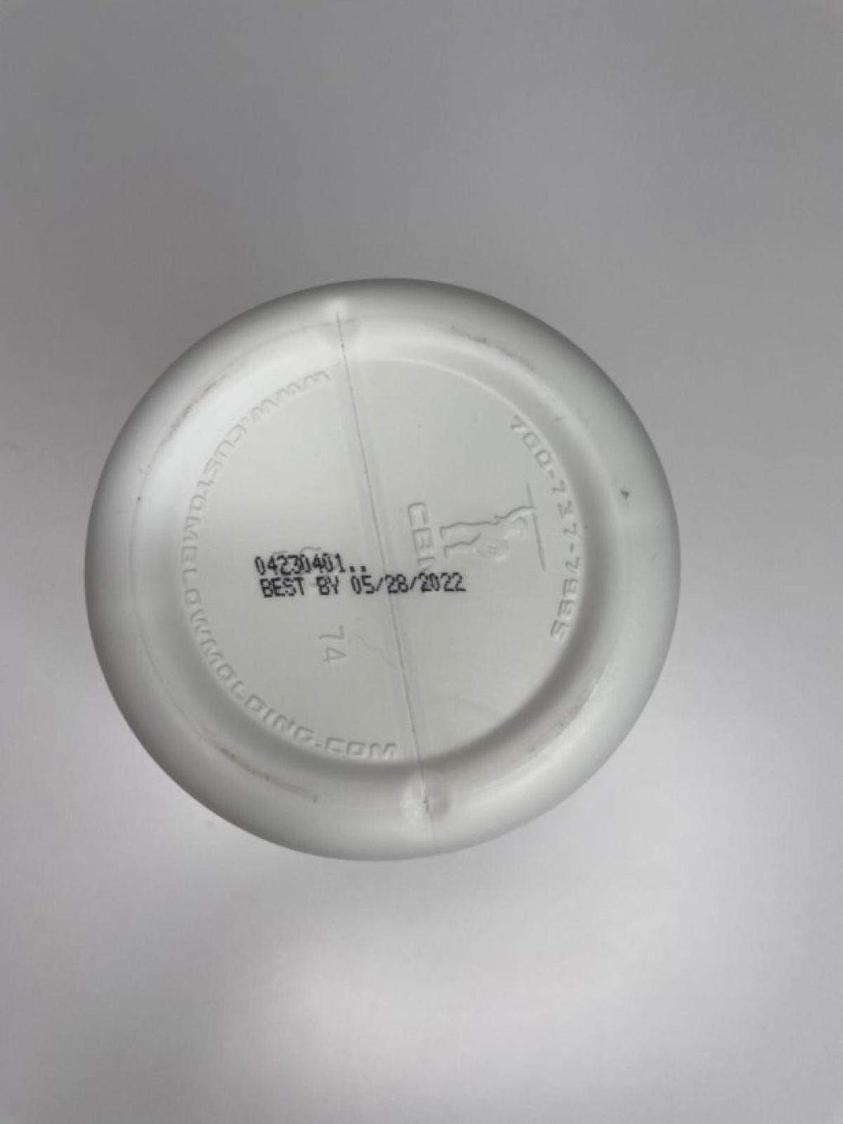 The BUBS Naturals lot code and expiration date are located on the bottom of the container, in the bottom center of the panel.