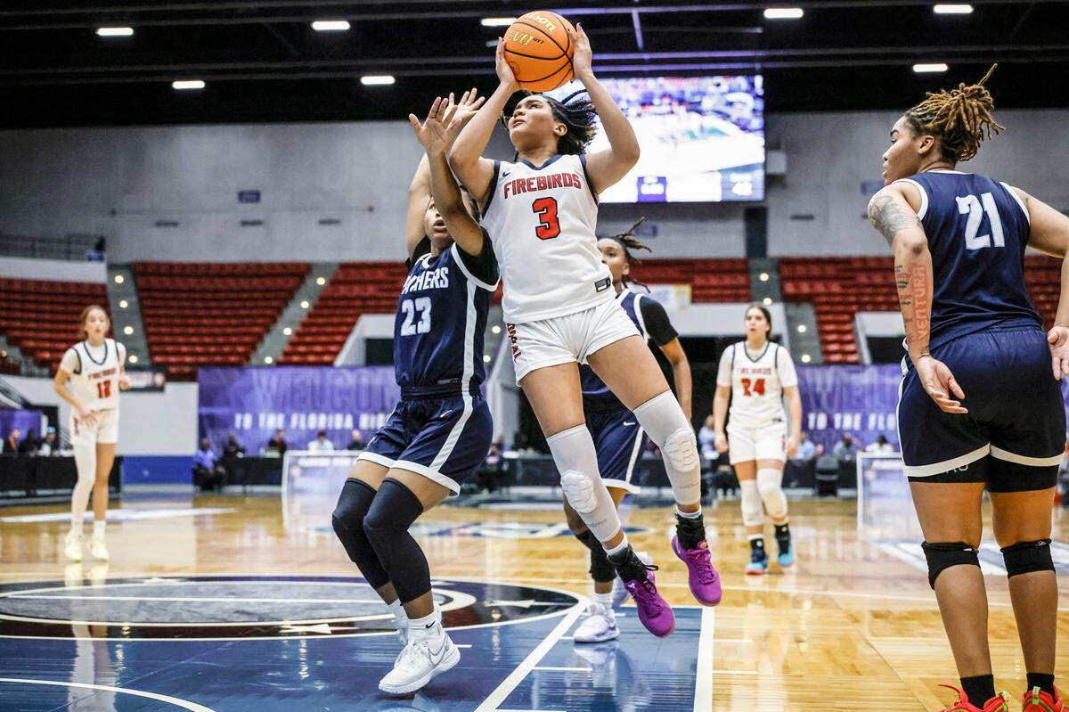 Doral Academy’s Victoria Valle (3) attempts to score as Dr. Phillips High School’s Kiarra Orphelia (23) defends in the second half for the FHSAA Class 7A Girls High School Basketball State Championship.
