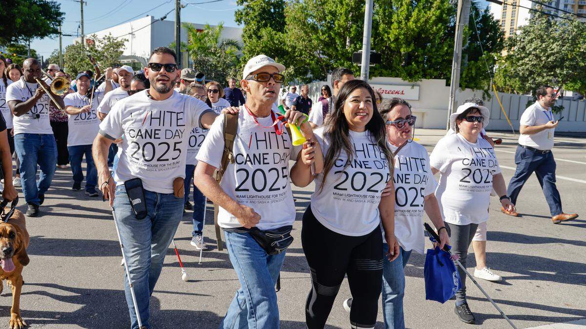 White Cane Day marchers were escorted by community leaders and first responders.