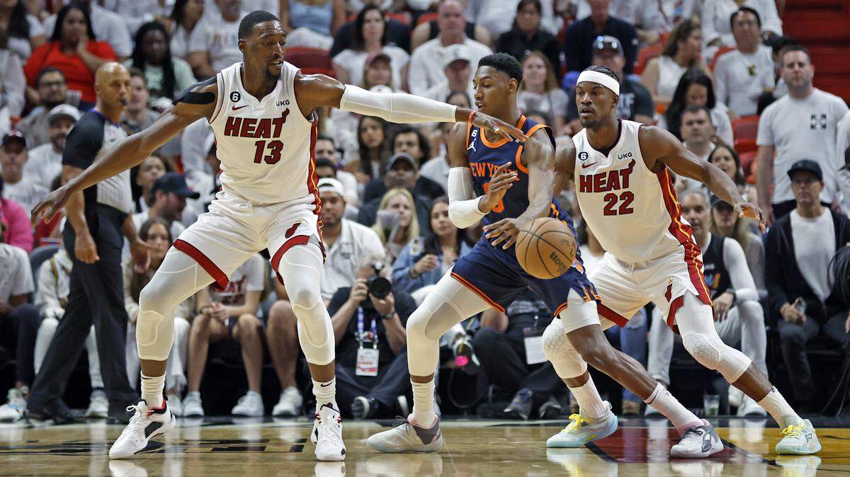 Miami Heat center Bam Adebayo (13) and forward Jimmy Butler (22) defend against New York Knicks guard Josh Hart (3) in the first quarter during Game 3 of the NBA Eastern Conference Semifinals at the Kaseya Center in Miami on Saturday, May 6, 2023.