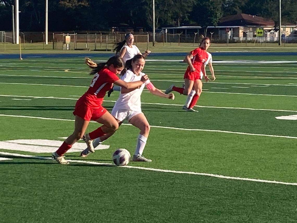 MAST Academy forward Josefina Tedin races Palmetto’s Leski Herskowitz to a loose ball during Friday’s GMAC championship game at Traz Powell Stadium.