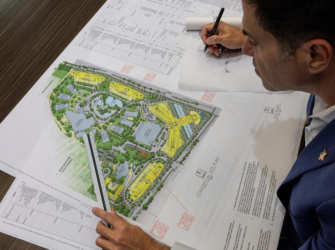 Miami-Dade attorney Felix Lasarte looks over proposed plans and renderings of an expansion to Trump National Doral at PPKS Architecture on Tuesday, Dec. 17, 2024, in Doral, Florida.