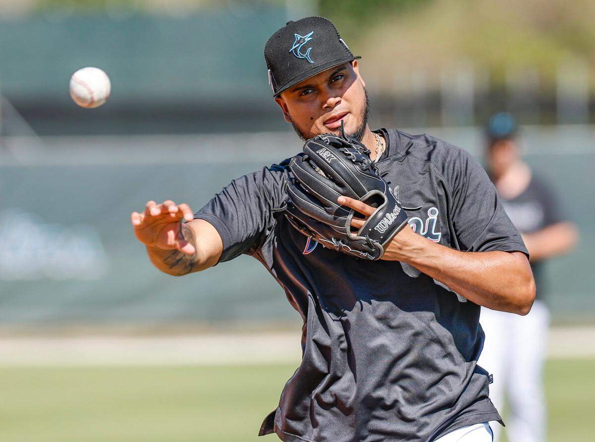 Miami Marlins infielder Luis Arraez throws a ball during a fielding drill during spring training at Roger Dean Chevrolet Stadium in Jupiter, Florida on Tuesday, February 21, 2023.