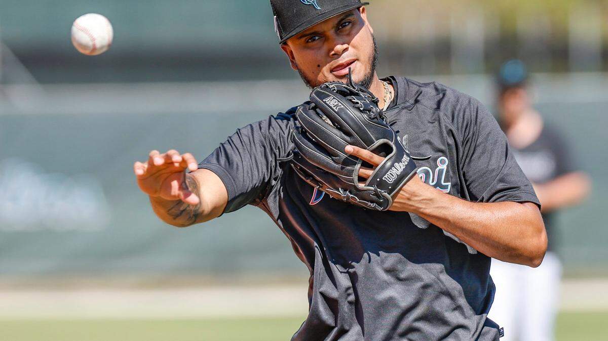 Miami Marlins infielder Luis Arraez throws a ball during a fielding drill during spring training at Roger Dean Chevrolet Stadium in Jupiter, Florida on Tuesday, February 21, 2023.