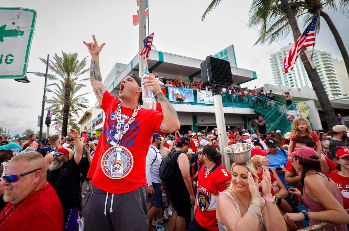 A Florida Panthers fan Kenny Shane, left, who got here from from Stuart at 3:30 and was the first one here, cheers outside of Elbo room “slept in my Jeep in the garage” before the Stanley Cup victory parade at Fort Lauderdale Beach on Tuesday, June 30, 2024 in Fort Lauderdale.&nbsp;