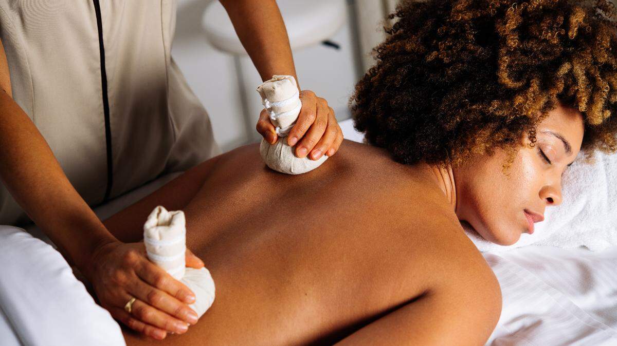 A client gets a Thai Muscle Recovery massage at âme Spa & Wellness Collective at JW Marriott Miami Turnberry Resort in Aventura, which is participating in Miami Spa Months.