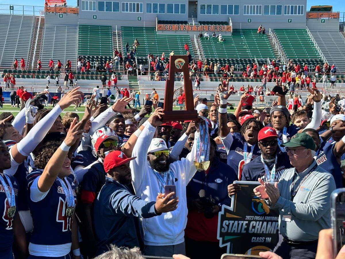 Chaminade-Madonna’s football team celebrates after beating Clearwater Central Catholic on Thursday at Bragg Memorial Stadium in Tallahassee, Fla.