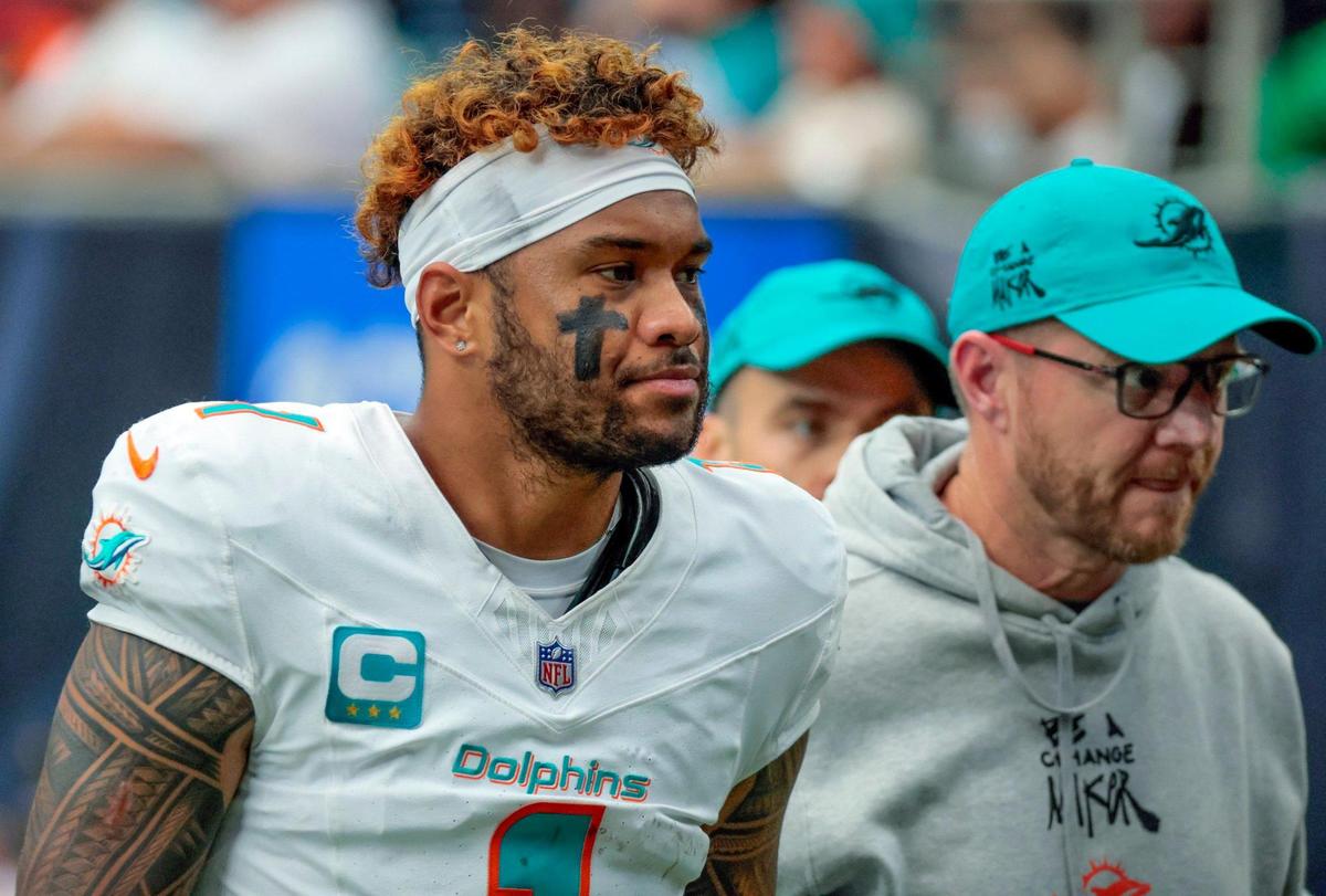 Miami Dolphins quarterback Tua Tagovailoa (1) walks of the field during halftime of their NFL game against the Houston Texans at NRG Stadium in Houston, Texas, on Sunday, December 15, 2024.