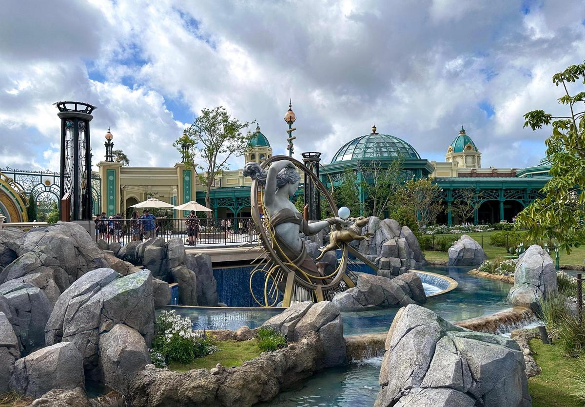 A statue of Luna, the Roman goddess of the moon, and her rabbit Lepus, greet guests as they enter Celestial Park inside Universal Epic Universe.