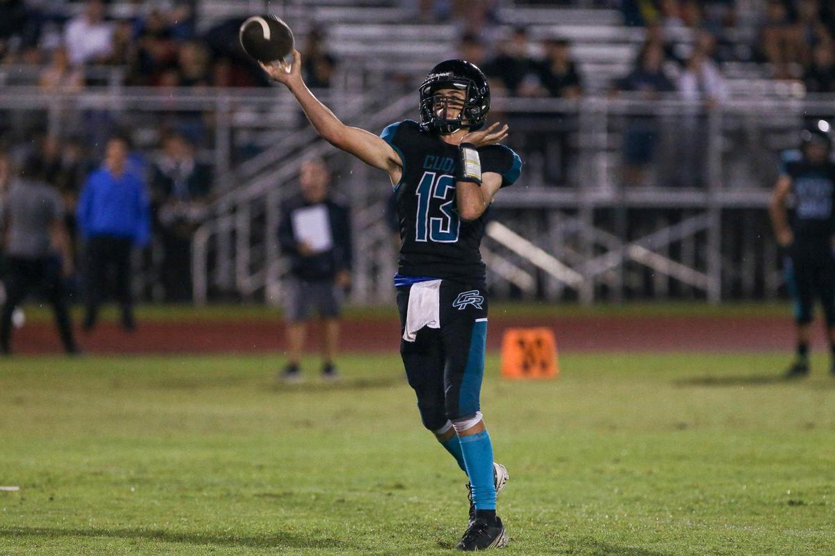 Coral Reef quarterback Colin Ferzli (13) throws a touchdown pass during the first half of a high school football game against Braddock at Southridge Park in Miami, Florida, Thursday, September 15, 2022.