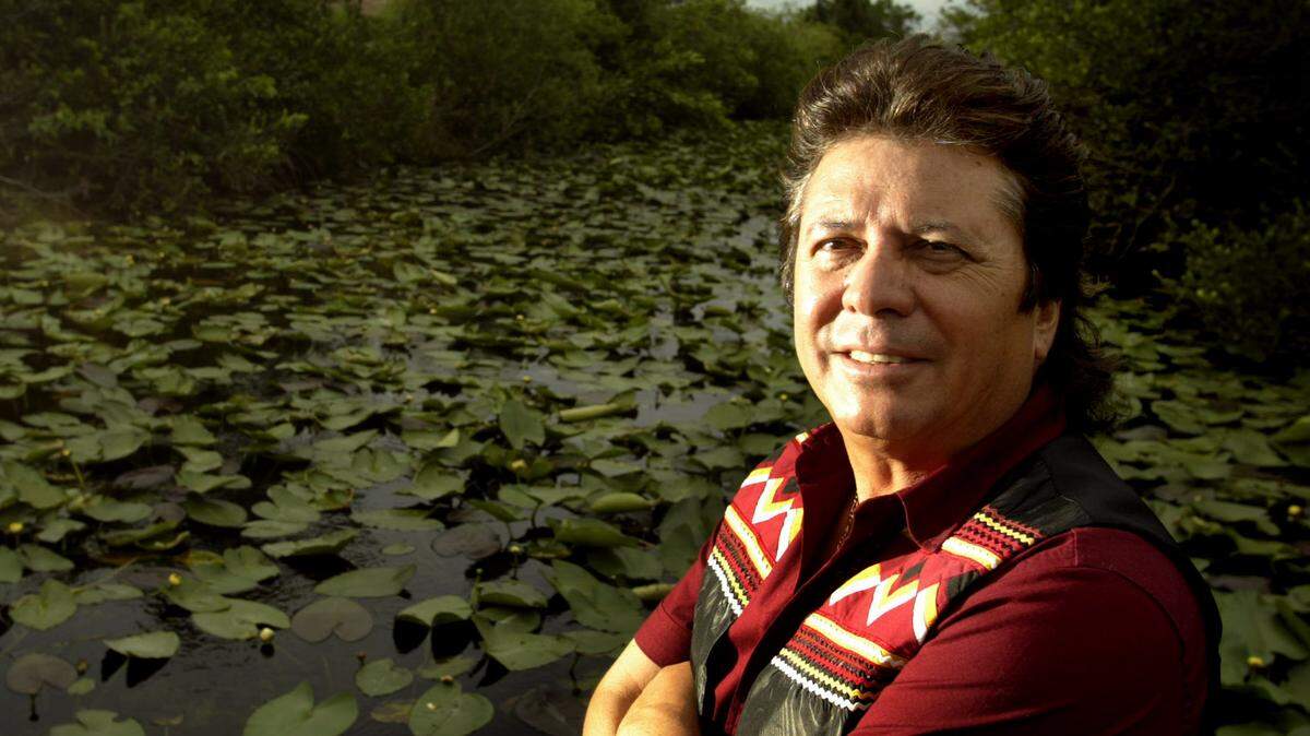 Lee Tiger, at the Miccosukee tribal village on Tamiami Trail in the Everglades in June, 2000, helped develop cultural tourism for the Miccosukee tribe and promoted eco-tourism for the Seminole tribe in South Florida.