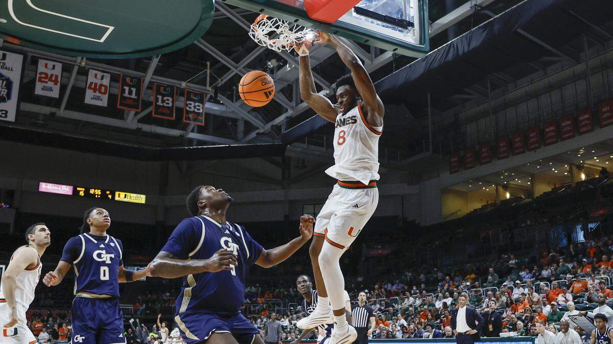 Miami Hurricanes center Ernest Udeh Jr. (8) dunks the ball against the Georgia Tech Yellow Jackets during the first half of an NCAA basketball game at the Watsco Center on the University of Miami Campus on Saturday, January 10, 2026 in Coral Gables, Florida.