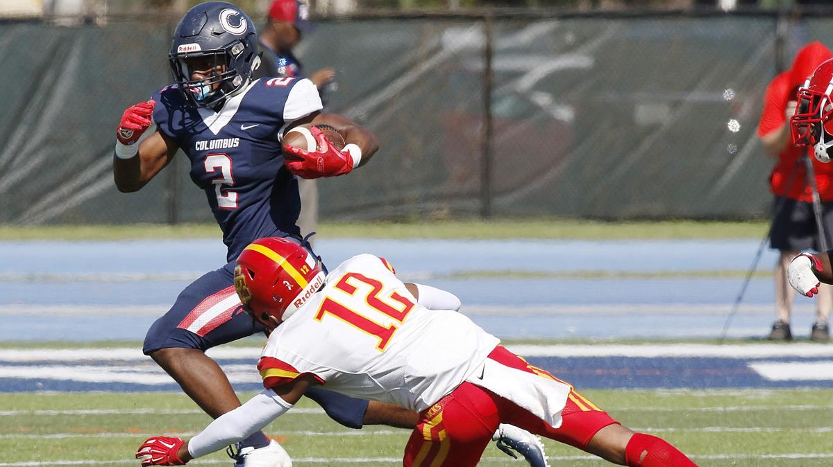 Columbus Explorers running back Henry Parrish Jr. (2) carries the ball against Deerfield Beach Bucks during the 8A state semifinal football game on Friday, November 29, 2019 at Tropical Park stadium in Miami