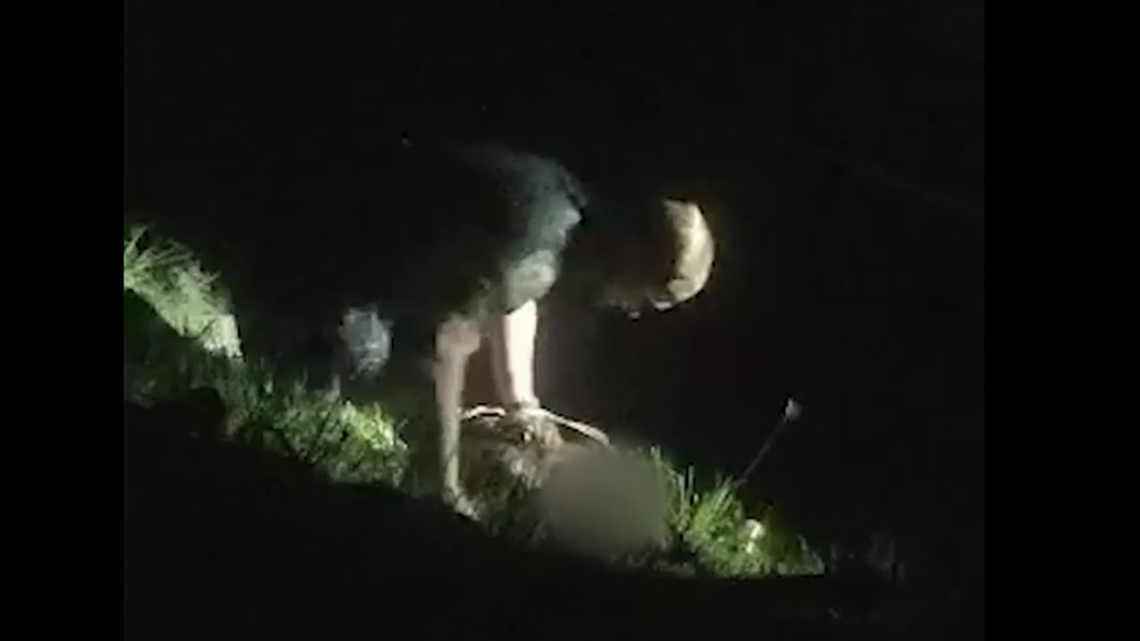 A Florida sheriff’s deputy is seen trying to revive a woman pulled from a car sunken in a Florida pond.