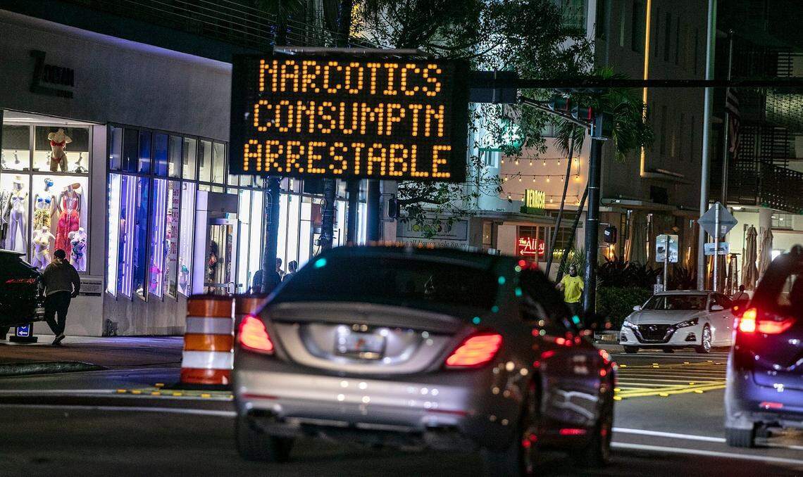 Spring breakers are greeted on South Beach with a warning that loud music and narcotics will get them arrested. (Pedro Portal/Miami Herald via AP)