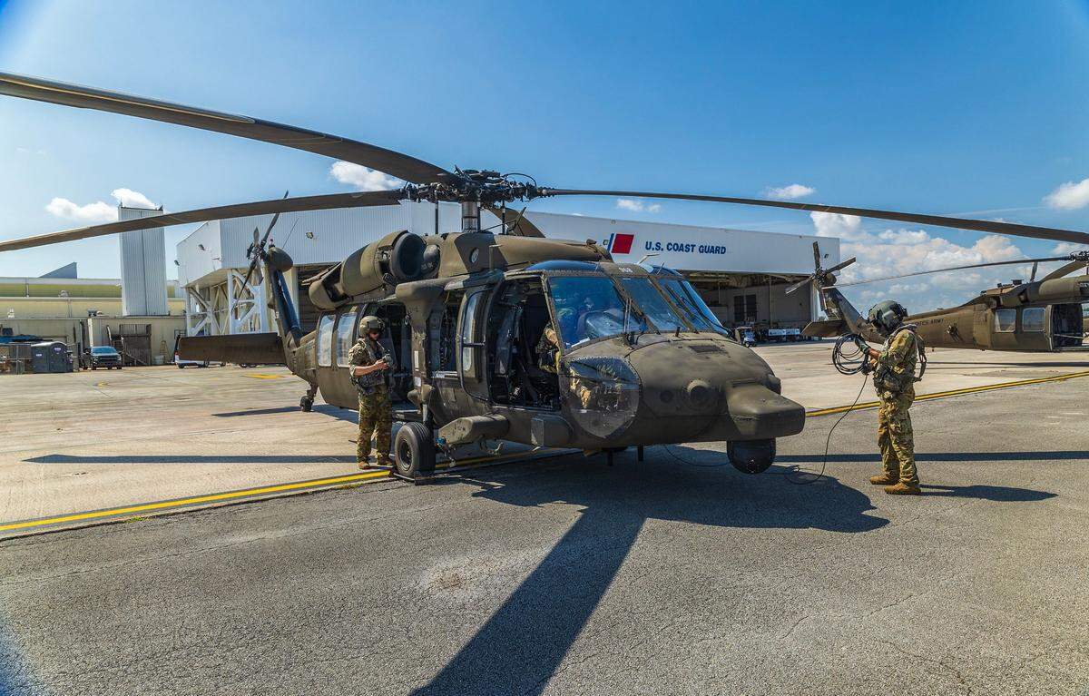 Pilots and crew members from the 8-229th Assault Helicopter Battalion (AHB), based at Fort Knox, Ky., prepare to depart from the U.S. Coast Guard Air Station in Opa-locka for a practice flight over South Beach. The exercise is part of preparations for the Hyundai Air & Sea Show, returning to Miami Beach for the annual National Salute to America’s Heroes on Friday, May 23, 2025.