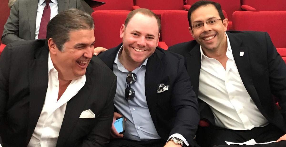 Three leaders of Miami-Dade Mayor Carlos Gimenez’s 2016 reelection campaign share a light moment before the swearing in of Miami Gardens Mayor Oliver Gilbert as the new chairman of the Transportation Planning Organization on Feb. 21, 2019. From left to right are Ralph Garcia-Toledo, who was Gimenez’s volunteer finance chairman; Brian Goldmeier, the hired fund-raiser for the 2016 race; and Jesse Manzano-Plaza, the campaign manager. Garcia-Toledo and Manzano-Plaza are part of a proposal by Genting to build and operate a county monorail system.
