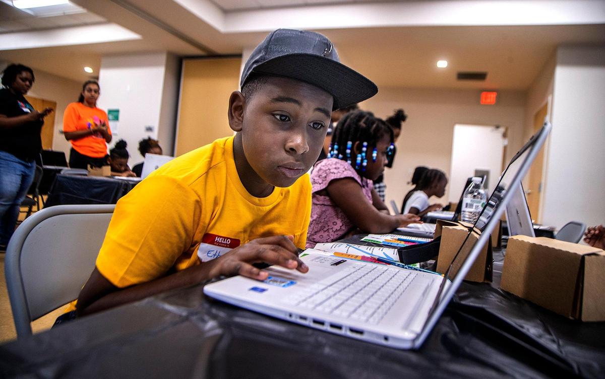 Ethan Dimanche works on a project during a STEAMtastic Saturday in Miami Gardens on Oct. 15, 2022.