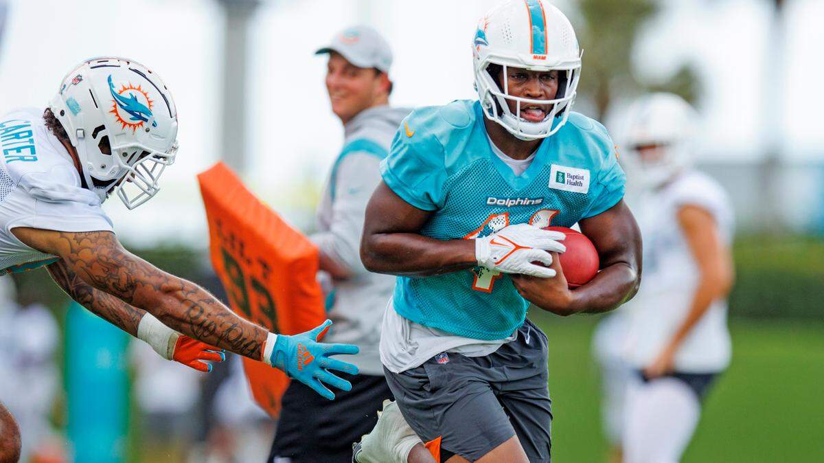 Miami Dolphins linebacker Channing Tindall (41) and tight end Cethan Carter (82) does drills during NFL football training camp at Baptist Health Training Complex in Hard Rock Stadium on Monday, September 5, 2022 in Miami Gardens, Florida.