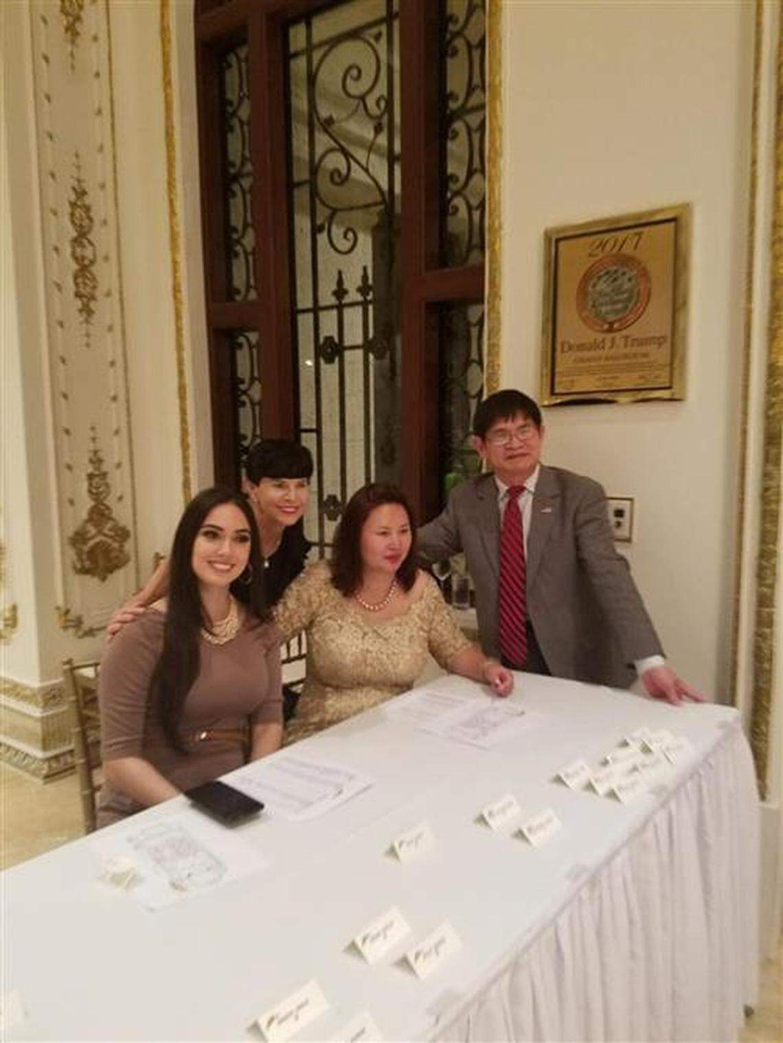 Daniel Lou (right) and Cindy Yang (center right) at the reception table at a ‘Safari Night’ gala at Mar-a-Lago, hosted by Elizabeth Trump Grau in January 2018.