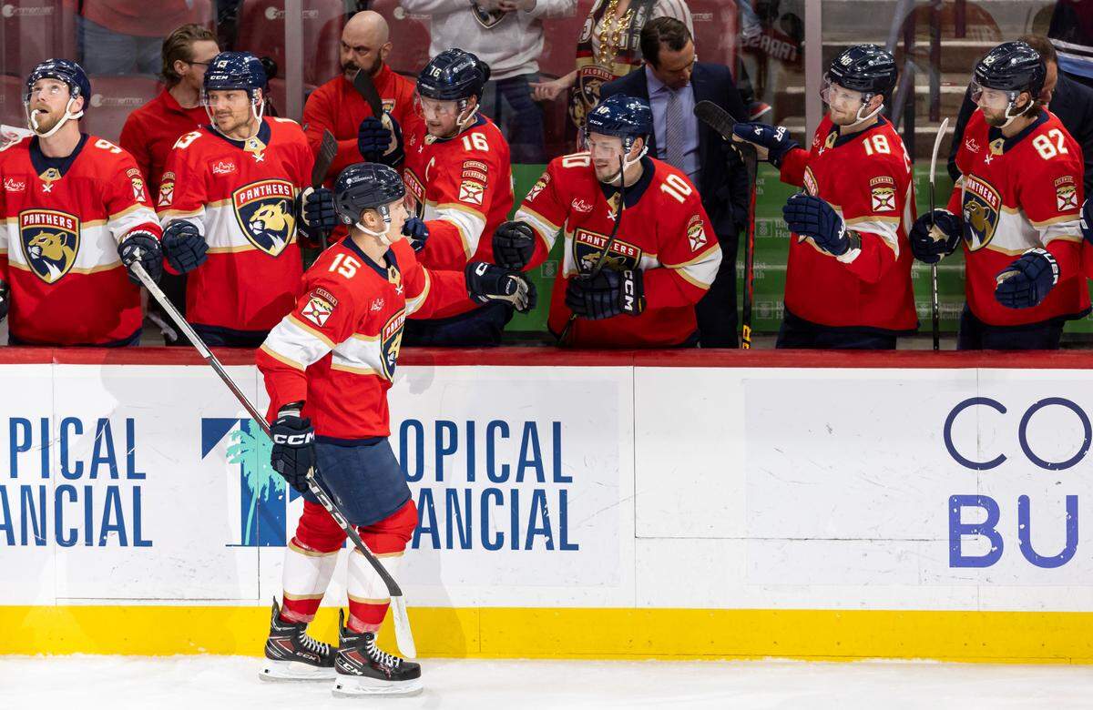 Florida Panthers center Anton Lundell (15) celebrates with his teammates after scoring a goal against the Buffalo Sabres in the first period of their NHL game at Amerant Bank Arena on Saturday, April 13, 2024, in Sunrise, Fla.