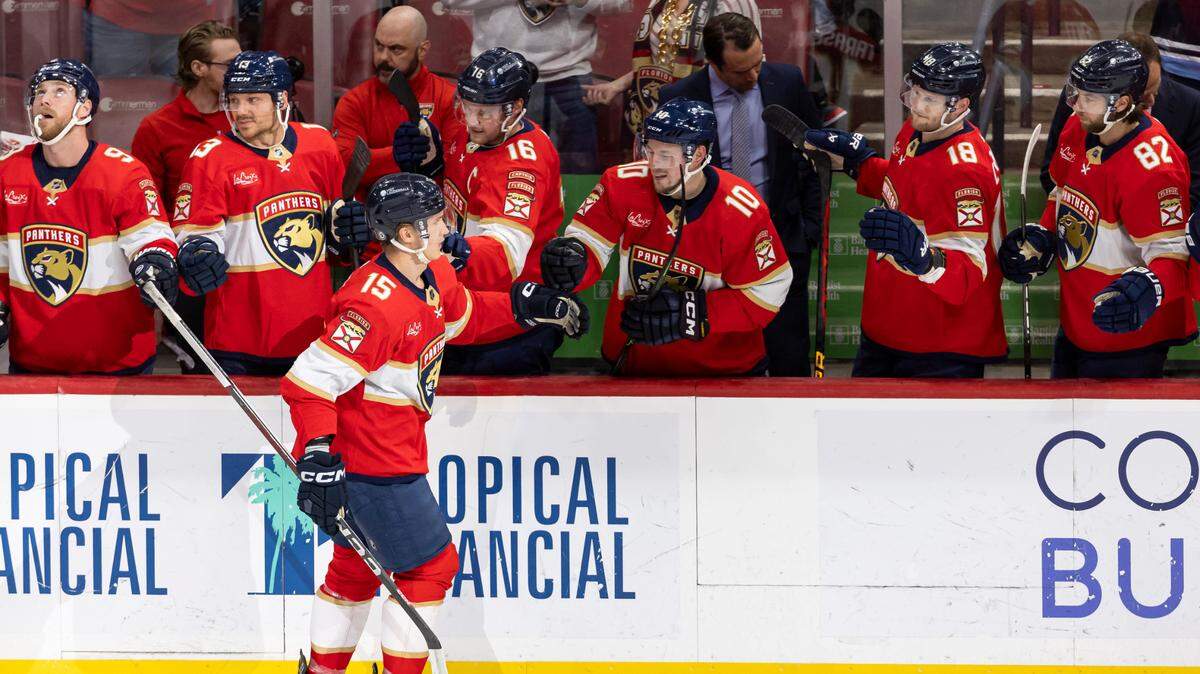 Florida Panthers center Anton Lundell (15) celebrates with his teammates after scoring a goal against the Buffalo Sabres in the first period of their NHL game at Amerant Bank Arena on Saturday, April 13, 2024, in Sunrise, Fla.