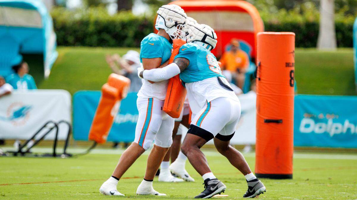 Miami Dolphins defensive tackle Raekwon Davis (98) and Dolphins defensive end Zach Sieler (92) does drills during NFL football training camp at Baptist Health Training Complex in Hard Rock Stadium on Friday, August 5, 2022 in Miami Gardens, Florida.