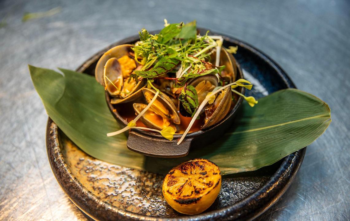 Hearth roasted local clams served “souse style” are one of Chef Tristen Epps’ signature dishes at Ocean Social.