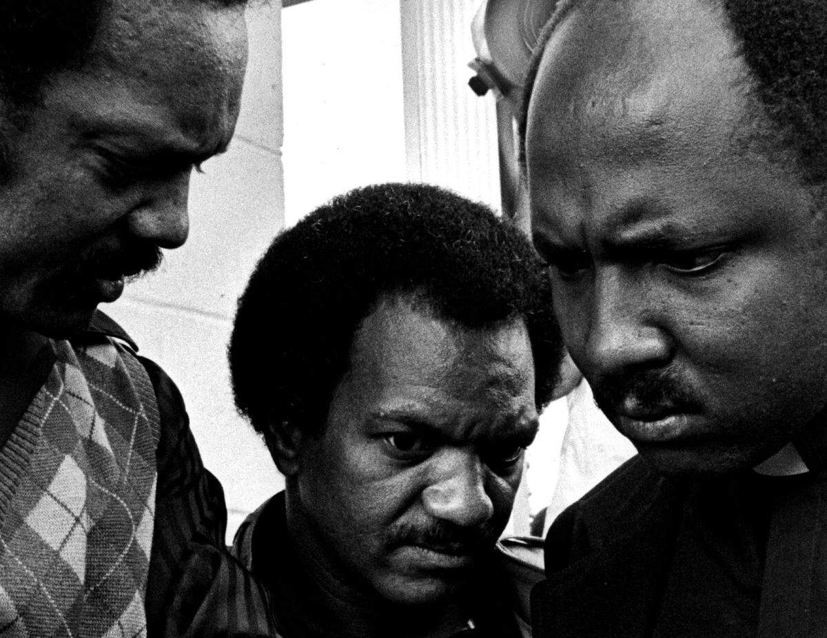 The Rev. Jesse Jackson, Ray Fauntroy of the Southern Christian Leadership Conference and the Rev. Jean Juste outside the Krome detention center in 1982.