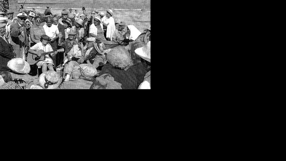 SOUTH BEACH SCENE: Miami Beach's  South Beach has become a 'hot scene' that lures many international 'jet-setters' who come to enjoy the music of such top performers as Courtney Love, shown here playing the guitar for an appreciative audience that includes (clockwise) Sean Penn, Sylvester Stallone, Ivana Trump, the Rolling Stones, Jack Nicholson, Madonna, Ru Paul, Kurt Cobain and the cast of Friends.