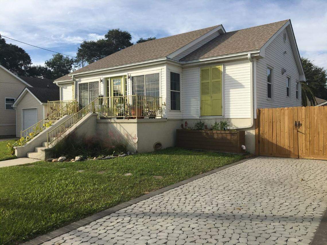 A New Orleans resident’s home now features a permeable pavement driveway and landscaping designed to absorb floodwater. They received a grant from the New Orleans community adaptation program to make their home more resilient to sea level rise.