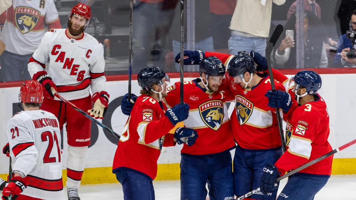 Florida Panthers defenseman Niko Mikkola (77) celebrates with teammates Aleksander Barkov (16), Jesper Boqvist (70), and Seth Jones (3) after scoring a first-period goal against the Carolina Hurricanes in Game 3 of the Eastern Conference Final during the NHL Stanley Cup Playoffs at Amerant Bank Arena on Saturday, May 24, 2025, in Sunrise, Fla.