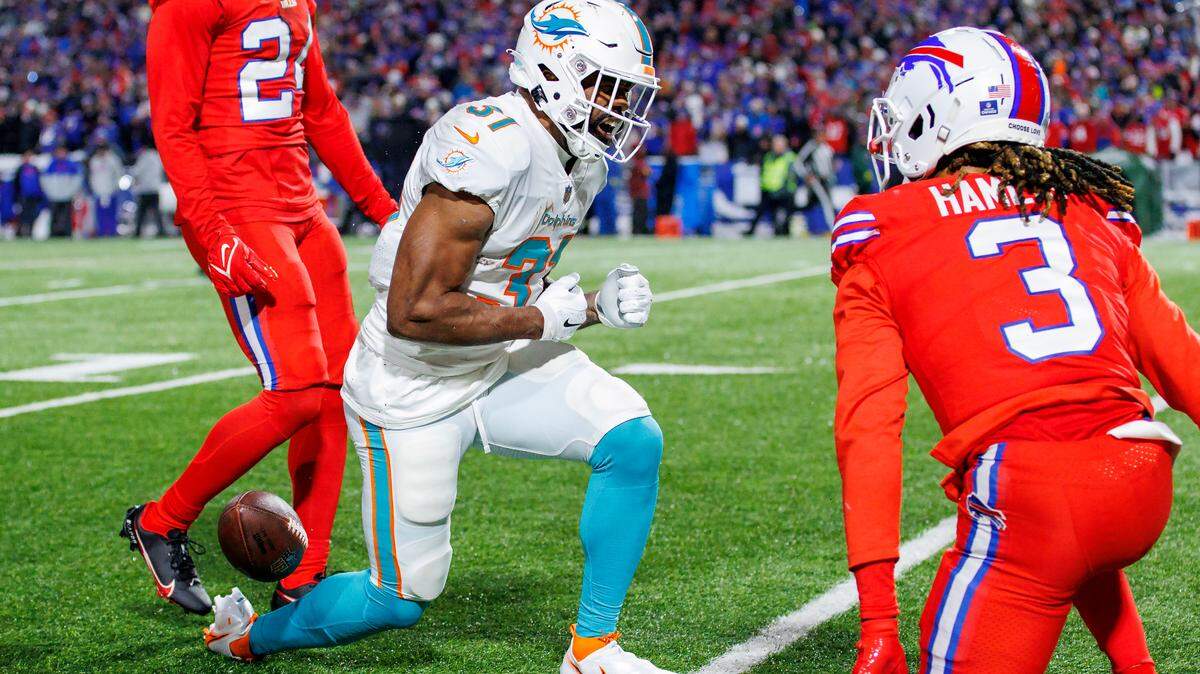 Miami Dolphins running back Raheem Mostert (31) reacts after running the football during first quarter of an NFL football game against the Buffalo Bills at Highmark Stadium on Saturday, December 17, 2022 in Orchard Park, New York.