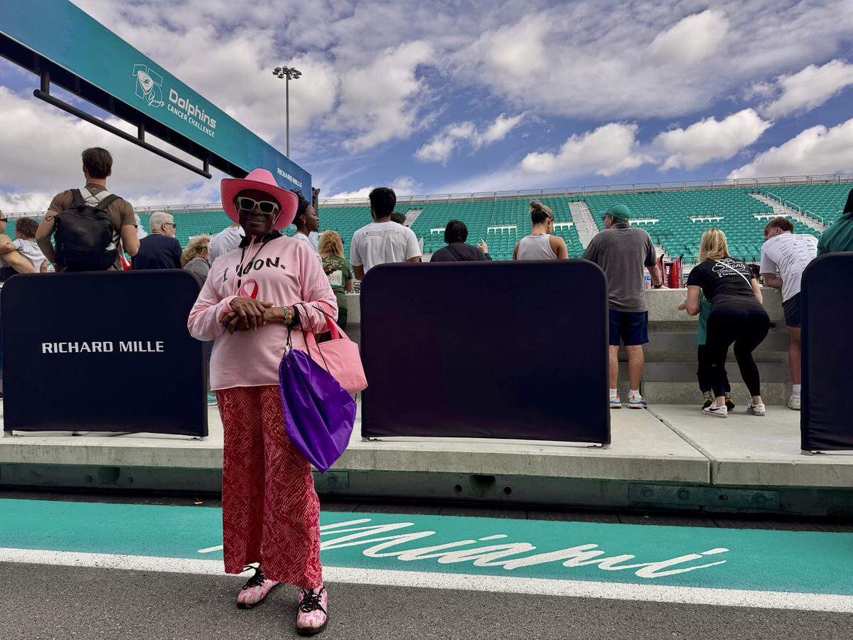 Lynette Hickenbottom, 72, poses at the Dolphins Cancer Challenge on Saturday, February 22, 2025 in Miami Gardens, Florida. A two-time cancer survivor, Hickenbottom comes to the DCC to spread a message of positivity and encouragement.